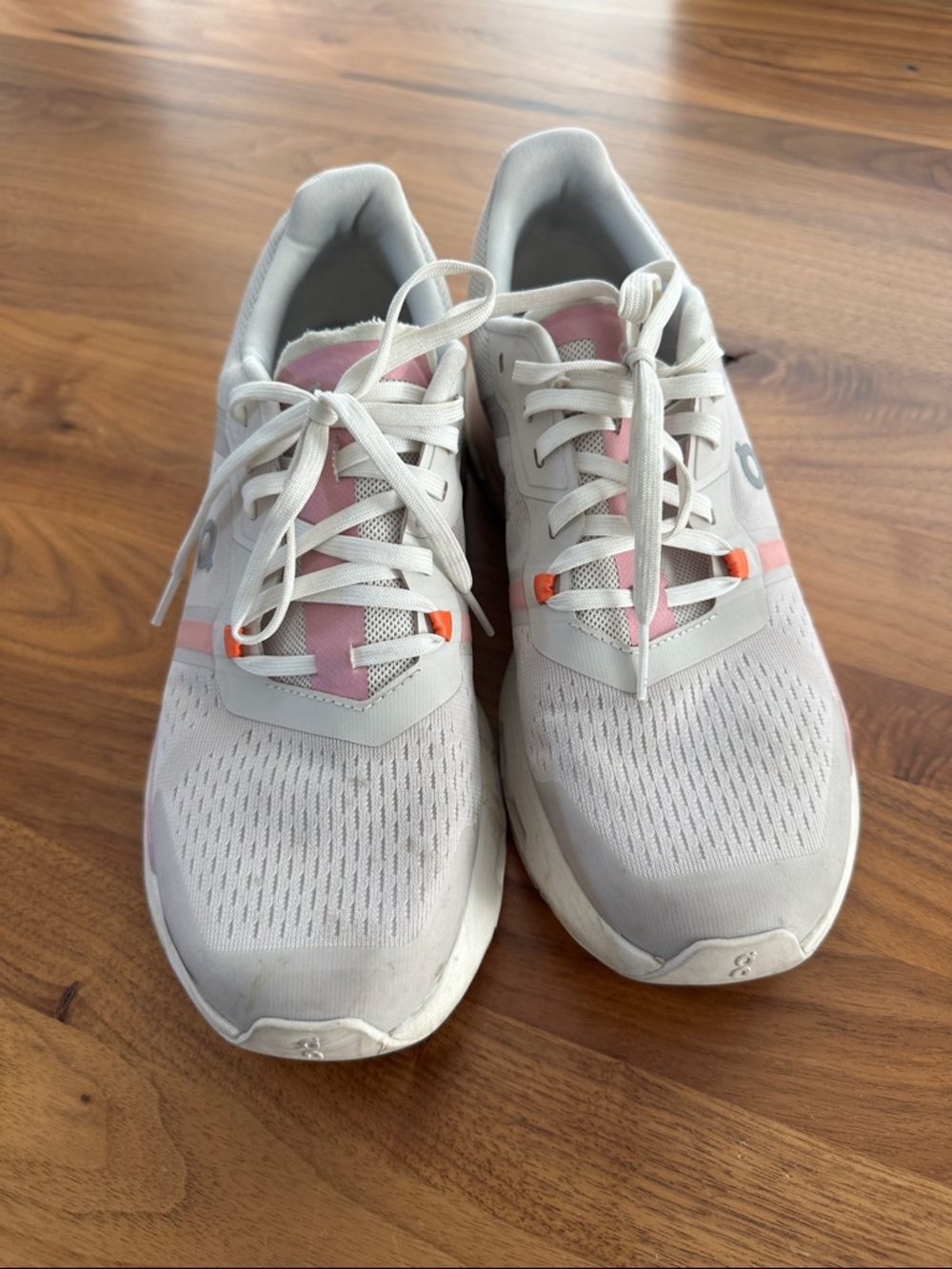 On Running Women's Athletic Trainers in White with Pink Accents